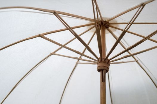 Closeup of fabric umbrella with bamboo frame assemble