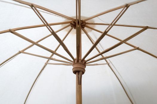 Closeup of fabric umbrella with bamboo frame assemble