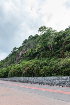 Lane of asphalt road with the mountain landscape