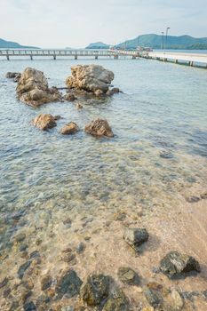 Landscape of rock in the ocean with bridge