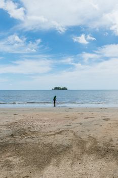 Fisherman with him job on the beach