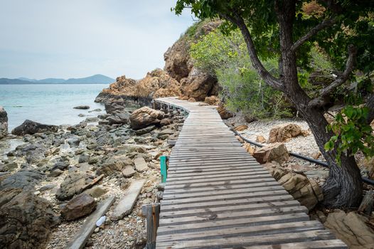 Wooden pathway with rock valley or cliff on the island