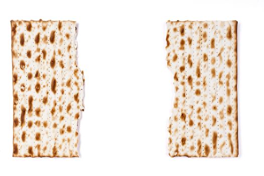 Brocken Square Matzah with white copyspace between the pieces isolated on white background