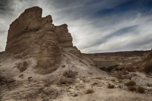 Arid Rock Desert Mountain Peack With Cloudy Sky