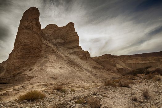 Arid Rock Desert Mountain Peak With Cloudy Sky