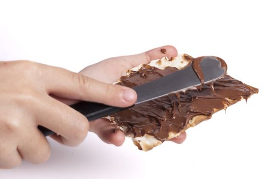 Jewish Child Hand Macking Chocolate with Matzah Traditional Passover Sweet