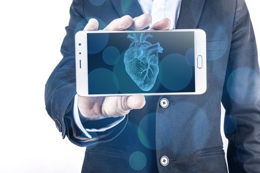 Smartphone and heart in hand isolated on white background