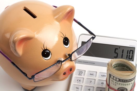 Piggy Bank With Dollars Roll and Calculator Isolated on White Background