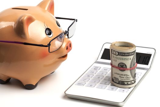 Piggy Bank With Dollars Roll and Calculator Isolated on White Background