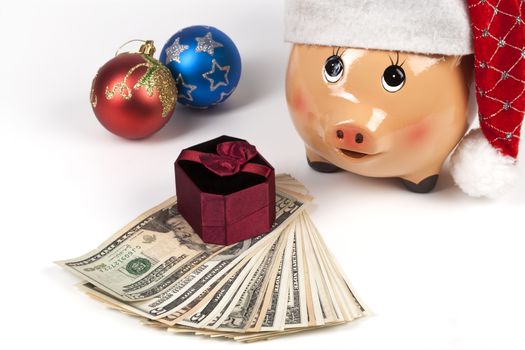 Piggy Bank with Dollars and Chtistmas Gift Box and Decorations
