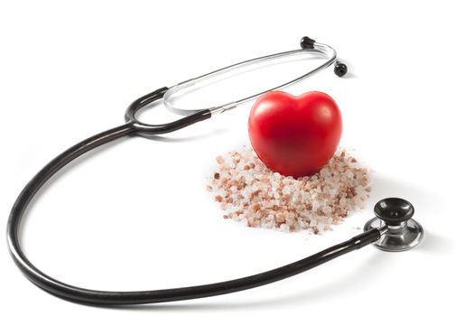 Himalayan Salt Raw Crystals With Red Heart and Black Stethoscope Isolated on White Background