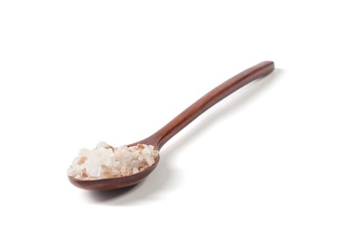 Himalayan Salt Raw Crystals Pile with Brown Wood Spoon Isolated on White Background