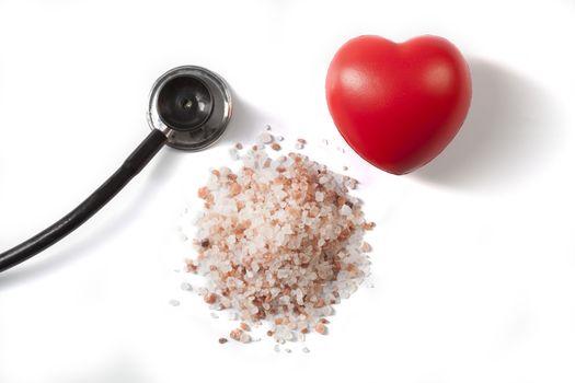 Himalayan Salt Raw Crystals With Red Heart and Black Stethoscope Isolated on White Background