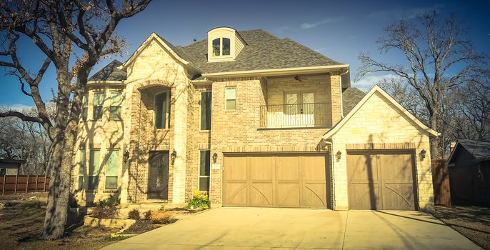 Vintage tone image a brand new construction single-family house with attached garage near Dallas, Texas, USA