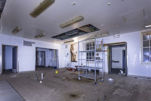 Kitchen area of Peat Island Asylum, the cookers were probably in the centre where the exhaust extractor is.  Last date on calendar 10 October 2010 when the last meals were cooked here.