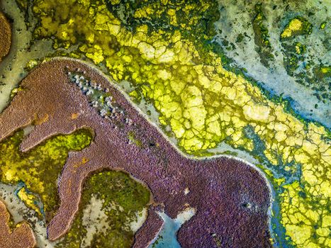 The interesting aerial perspective, colours, patterns and textures of Nangudga Lake, estuary ocean lagoon in the Eurobodalla region Australia