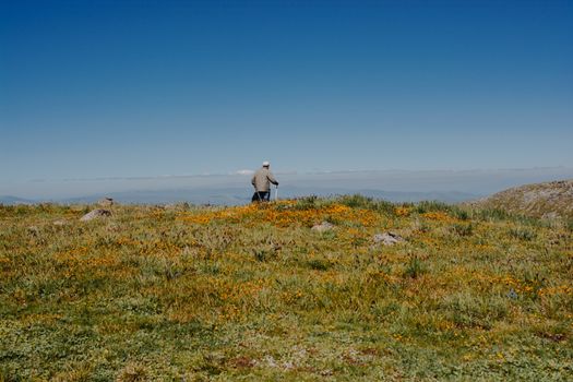 hikers with backpacks and trekking poles walking in Turkish highland