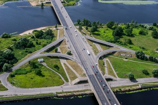 Aerial view of Riga city- capital of Latvia. Road with moving cars. Riga from above.