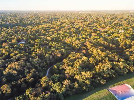 Aerial drone view Kessler Park located just south of downtown Dallas, Texas, USA. Flyover nature area with mature trees and rolling hill terrain