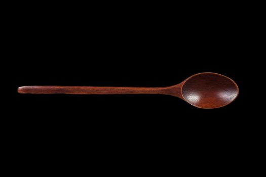 Brown Wood Table Spoon Isolated on Black Background