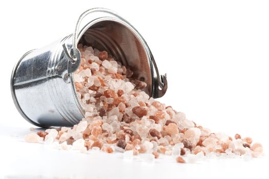 Himalayan Salt Raw Crystals Pile in Silver Metal Bucket Isolated on White Background