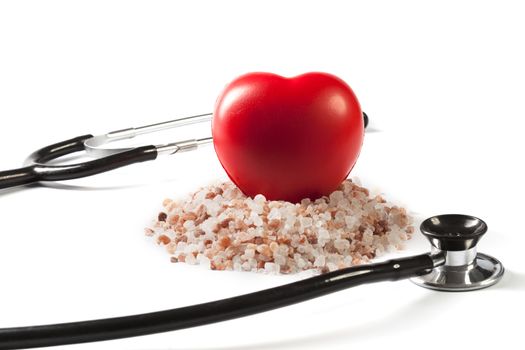 Himalayan Salt Raw Crystals With Red Heart and Black Stethoscope Isolated on White Background