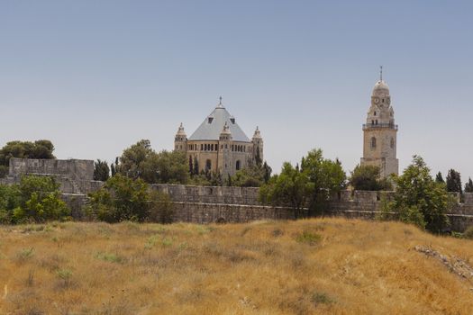 Old Jerusalem church with yellow dry grass