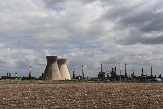 Industry and agriculture landscape with cloudy sky