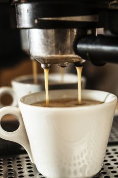 Big coffee machine doing delicious coffee in the morning