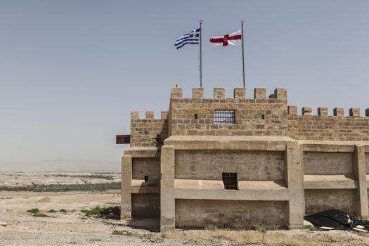 A old building with two flags on it