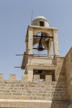 A view of old building with a bell