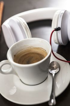 A white cup filled with delicious coffee