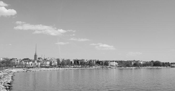 View from the shoreline of Munkkisaari district, across the water to Pyhän Birgitan Park in Eira District, Helsinki, Finland - monochrome processing