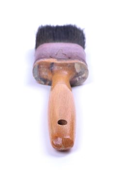 Old and used paint brush, on white background