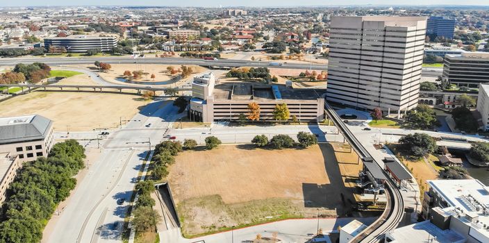 Panorama aerial view downtown Las Colinas, Irving, Texas and light rail system (Area Personal Transit, APT). Las Colinas is an upscale, developed area in the Dallas suburb