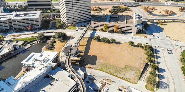 Panorama aerial view downtown Las Colinas, Irving, Texas and light rail system (Area Personal Transit, APT). Las Colinas is an upscale, developed area in the Dallas suburb