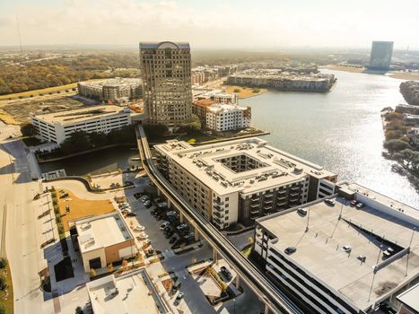 Aerial view downtown Las Colinas, Irving, Texas and light rail system (Area Personal Transit, APT). Las Colinas is an upscale, developed area in the Dallas suburb