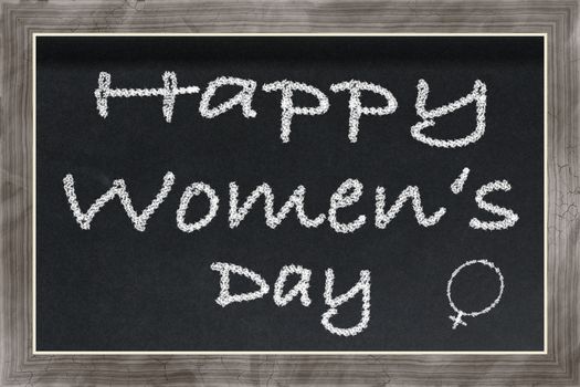Black Chalkboard with wooden frame and text Happy Women's Day and women's sign