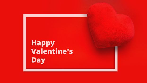 Happy Valentines day background with soft toy heart on red background. Top view. For banner, cards design
