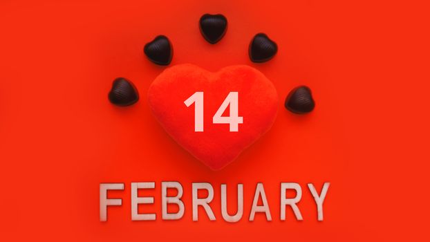 Valentines day background with soft toy heart and chocolates on red background. Top view. For banner, cards design