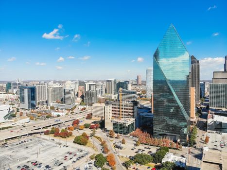 Aerial view of downtown Dallas, Texas during sunny autumn day with colorful fall foliages