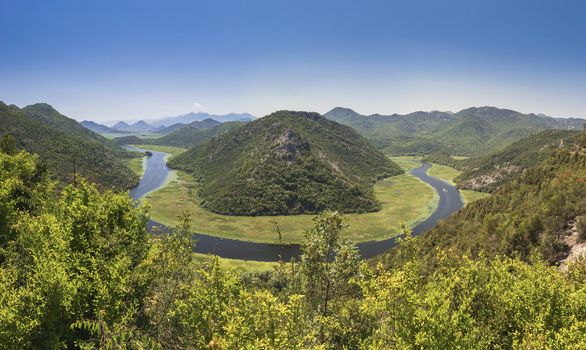 Panoramic view from above of the huge bend of Tsrnoyevicha river and the forest around, Rijeka Crnojevica in Montenegro