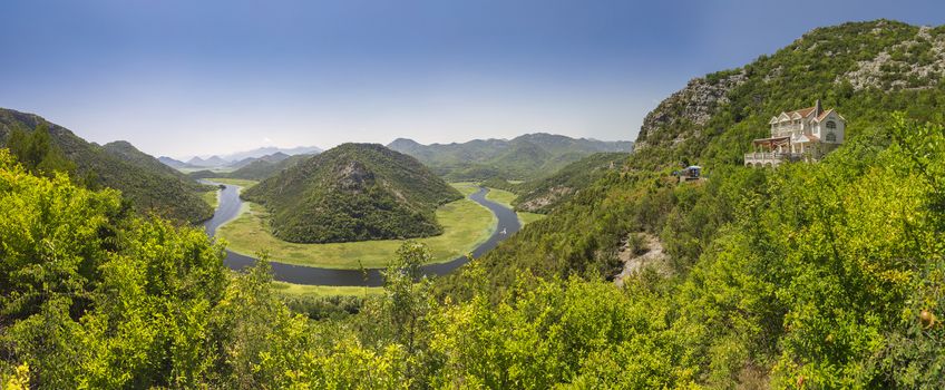 Panoramic view from above of the huge bend of Tsrnoyevicha river and the forest around, Rijeka Crnojevica in Montenegro