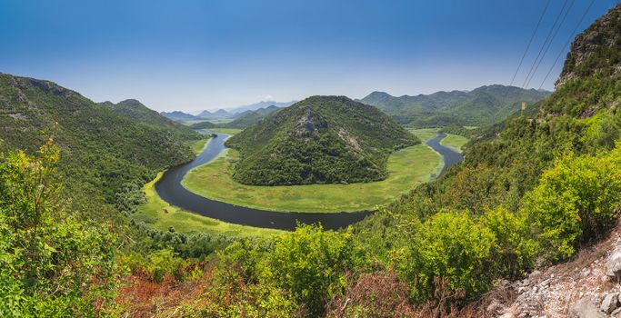 Panoramic view from above of the huge bend of Tsrnoyevicha river and the forest around, Rijeka Crnojevica in Montenegro