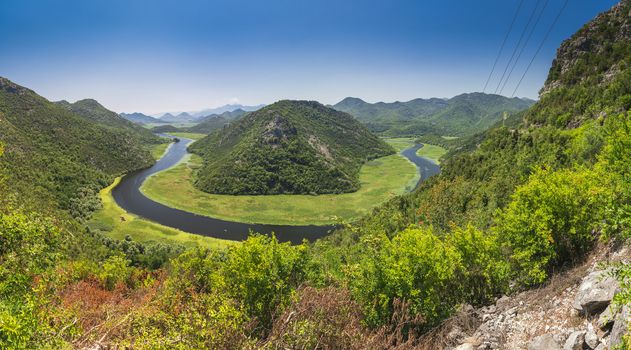 Panoramic view from above of the huge bend of Tsrnoyevicha river and the forest around, Rijeka Crnojevica in Montenegro