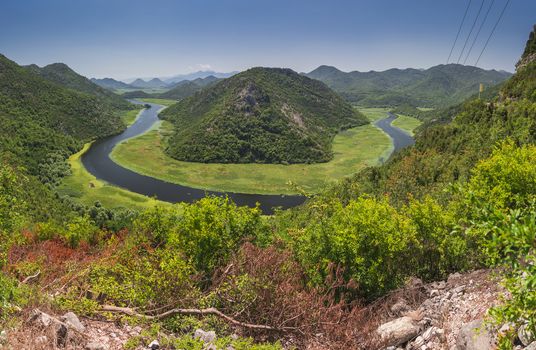 Panoramic view from above of the huge bend of Tsrnoyevicha river and the forest around, Rijeka Crnojevica in Montenegro