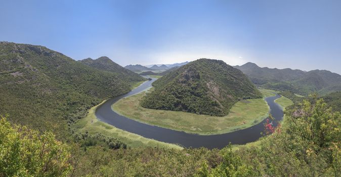 Panoramic view from above of the huge bend of Tsrnoyevicha river and the forest around, Rijeka Crnojevica in Montenegro