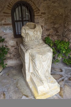 Sculpture from the villa of Herodes Atticus in the courtyard of Loukou Monastery.