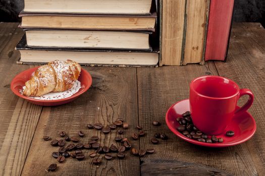 Morning Croissant and coffee with some books