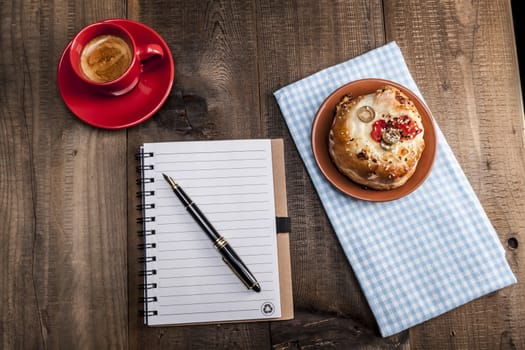 Coffee in red cup and some food